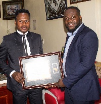 Executive Officer of EAD Group presenting the award to Apostle Francis Amoako Attah