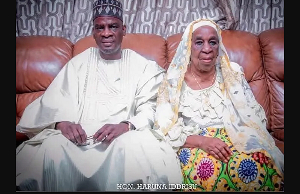 Haruna Iddrisu seated with his late mother Hajia Mariama