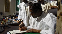 Nigerian President Muhammadu Buhari signs the AfCFTA ( AFP)