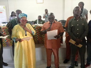 Greater Accra Regional Minister (L) with some of the DCEs after their confirmation