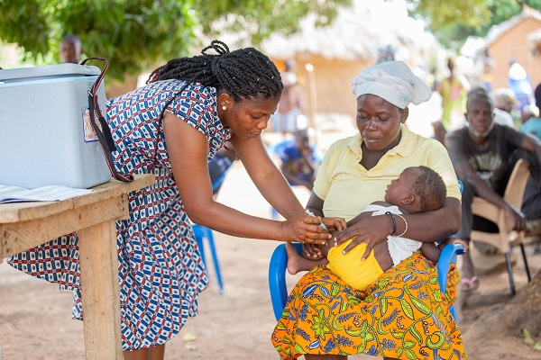 Dufe Dodzi recieves his childhood immunization during a catchup outreach