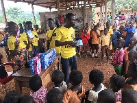 Members of the Rotaract Clubs of Accra-Labone and Accra-East distributing toothbrush to the pupils