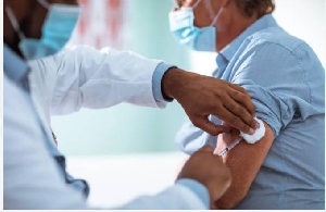 A man taking a vaccination