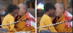 Dalai Lama 'tongue-kissing' a little boy at an event