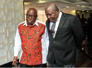 President Akufo-Addo (L) taking a walk with Martin Amidu (R)