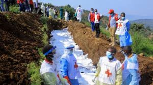 Congolese Red Cross buries victims of M23 rebel clashes in a mass grave