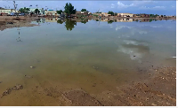 Floodwaters spread across a valley near the city of Abu Hamdan in the Northern state, Sudan, on Augu