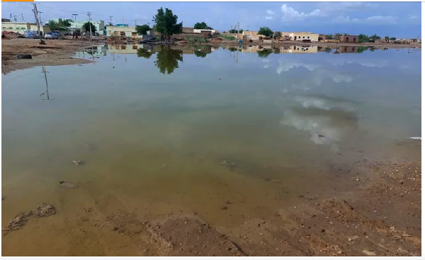 Floodwaters spread across a valley near the city of Abu Hamdan in the Northern state, Sudan, on Augu