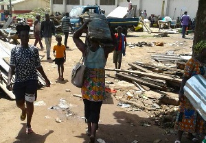 Some squatters at Kawukudi Brigade being moved out