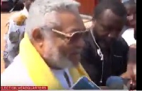 Former President Jerry John Rawlings speaks to the media after voting.