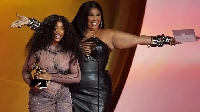 Lizzo (right) presented SZA with the best R&B song prize. Credit: Mike Blake