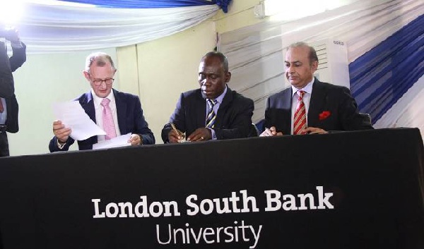 Dr. Daniel Okyere Walker signing the PUC with officials of LSBU