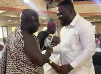 A photo of Paul Yandoh and Dr Frank Amoakohene at the ceremony