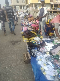 Traders busy selling on the Kaneshie footbridge in wee hours of the morning