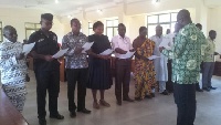 Mr. James Kofi Kutsoati and 10-member district task force