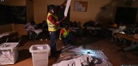 Electoral workers start to count votes at the Lycée Boganda polling station in the capital Bangui