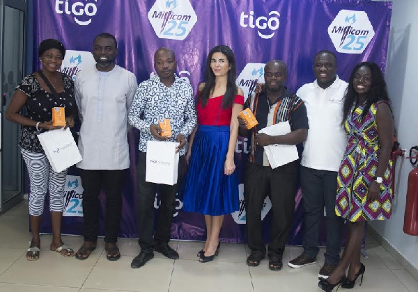 CEO of Tigo, Roshi Motman with some tigo top staff