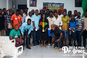 Prof. Dr. Grace Ayensu-Danquah (holding the trophy) with reps of the participating communities