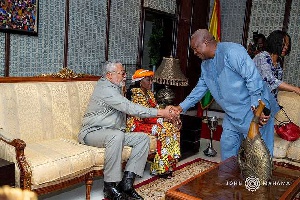 Mahama exchanges pleasantries with the Rawlings'