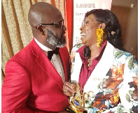 Ghanaian gospel musician Mz Nana (R) with her award