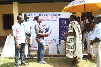 Joseph Osei Djaba presenting the items to one of the schools