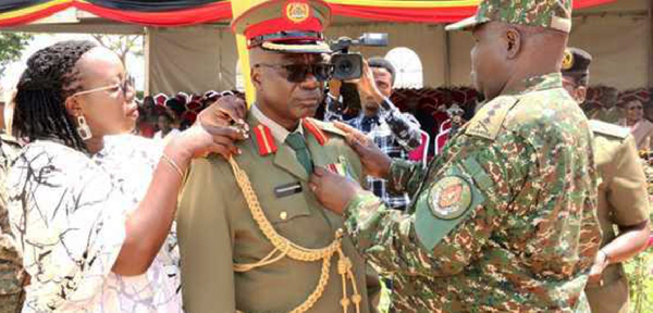 Brig Gen Richard Tukacungurwa is decorated by the Deputy Chief of Defence Forces, Lt Gen Sam Okiding