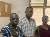 Ibrahim Iddrisu, Bawku youth president [L] with family members of the victims