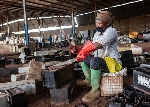 A woman working on metals