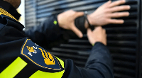 File photo of Dutch police officers arresting a man