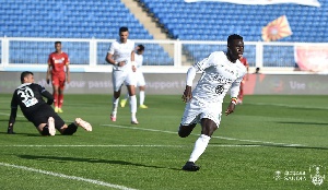 Ghanaian winger, Samuel Owusu (in white jersey)