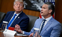 t Donald Trump listens as Pete Hegseth speaks during a cabinet meeting at Camp David in Thurmont