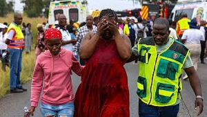 Relatives of school children weep at the scene of the crash in Vanderbijlpark
