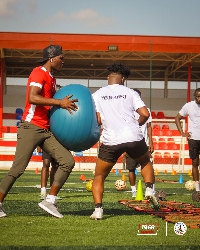 Totti Laryea on the field with some players
