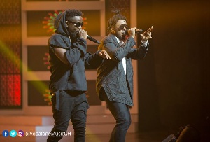 Sarkodie and Runtown performing on stage