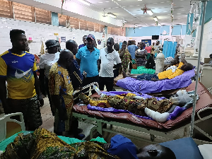 Charles Bissue is seen here with some of the victims of the explosion