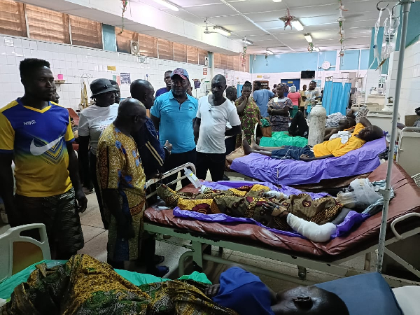 Charles Bissue is seen here with some of the victims of the explosion