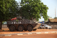 Military armoured vehicle takes position after mutineers attack the airport and presidential palace