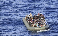 A group of 169 people were picked were picked up from an overflowing wooden boat