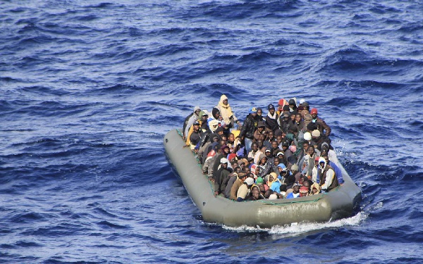 A group of 169 people were picked were picked up from an overflowing wooden boat