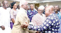 President Akufo-Addo shaking hands with Erasmus Kwabla Kalitsi (left), a retired CEO of VRA