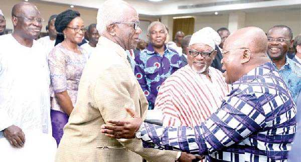 President Akufo-Addo shaking hands with Erasmus Kwabla Kalitsi (left), a retired CEO of VRA