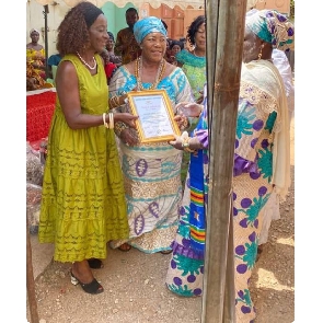 Sherry Ayittey making a presentation to some women