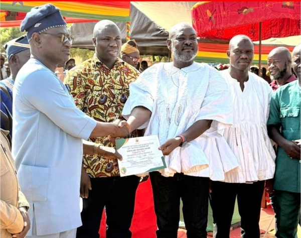 Alhaji Abdul-Rauf T Ibrahim is seen receiving an award as the Best Farmer for the Noth East Region