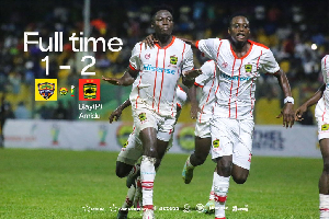 Justice Blay (L) celebrating his goal with his teammate