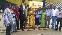 Beneficiaries of the educational support pose for the photograph