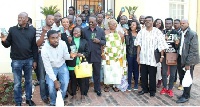 H.E. Kwesi Awhoi with Ghanaians in Pretoria showing off their new biometric passports