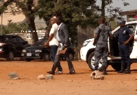 Francis Nabegmado being accompanied to the cells