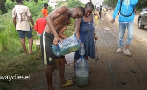 Residents collecting fuel from overturned tanker