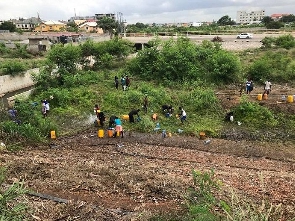 People fetching the oil after the accident