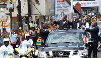 President Nana Addo Dankwa Akufo-Addo and President Alassane Ouattara waving to the people
